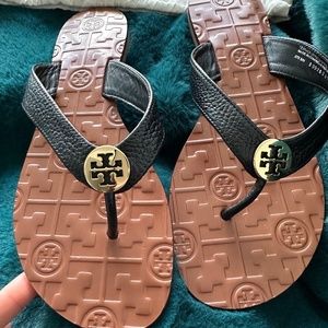 Tory Burch Thora black/gold sandals size 7.